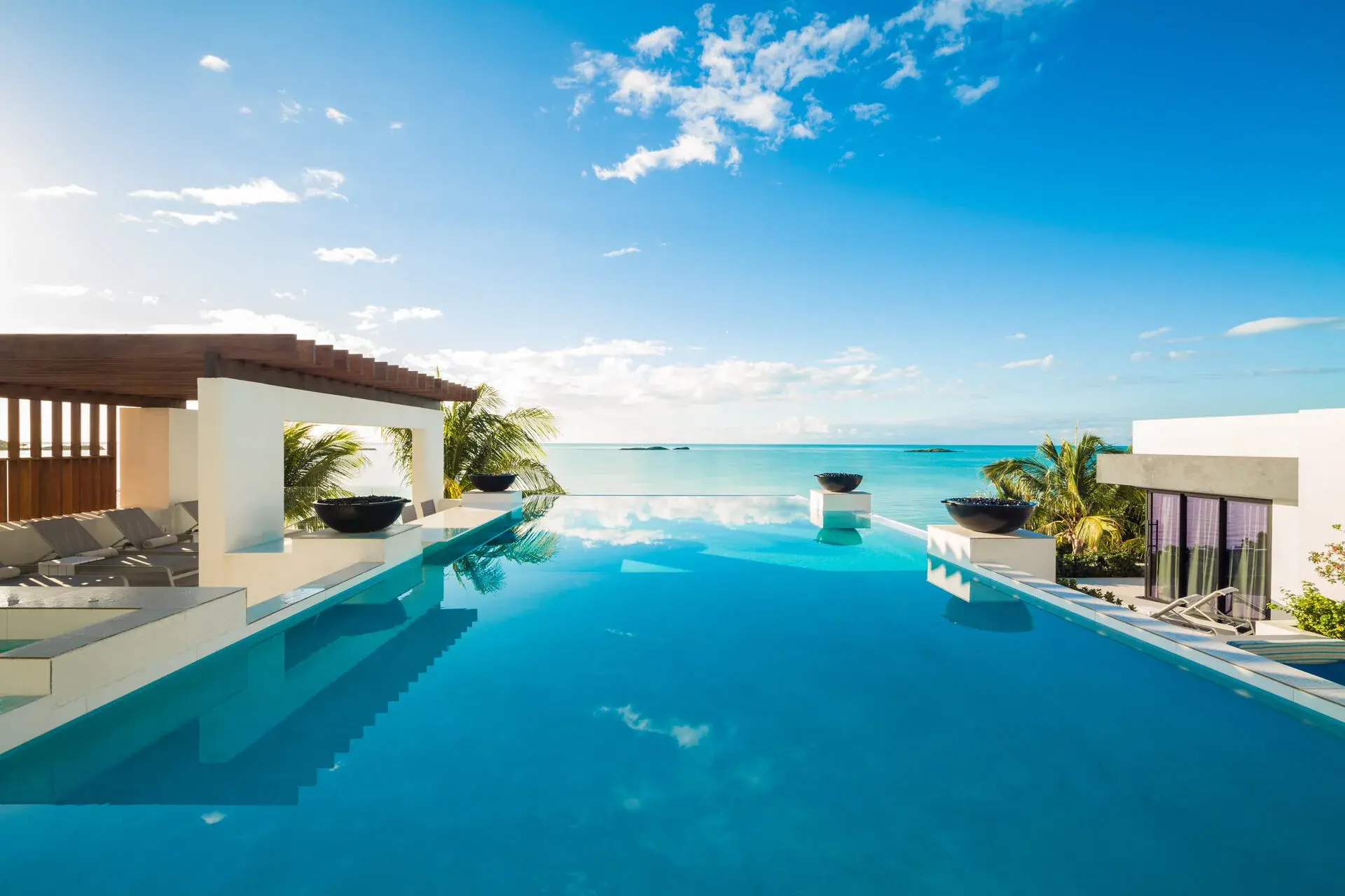 A private villa terrace and pool overlooking the water